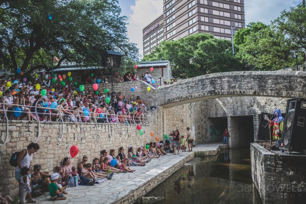 Children and their parents crowd the ampitheater at the Austin Symphony Orchestra "Children's Art Park"