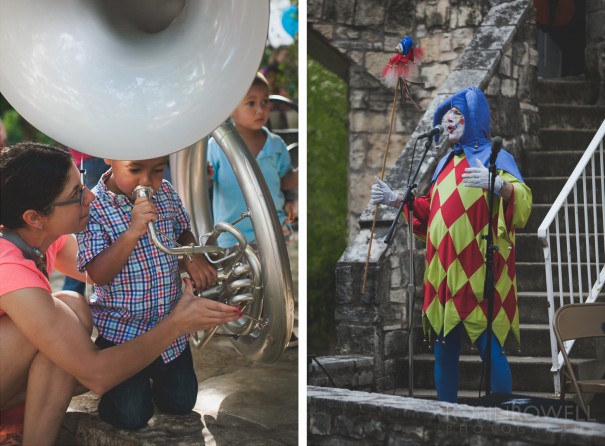 A child tries playing a tuba while a jester entertains the audience at the Austin Symphony Orchestra "Children's Art Park" ampitheater