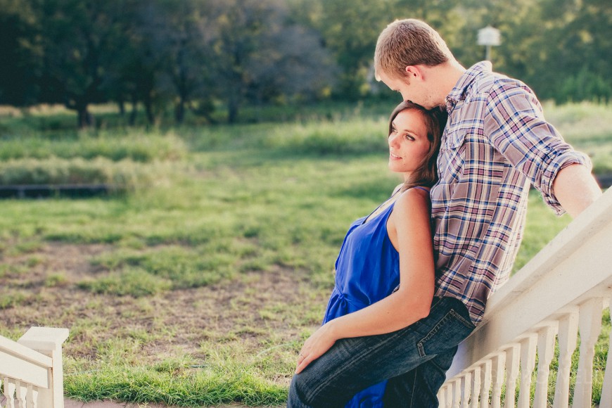 A country style engagement photo with Aubrey leaning back on Boone - Leander TX