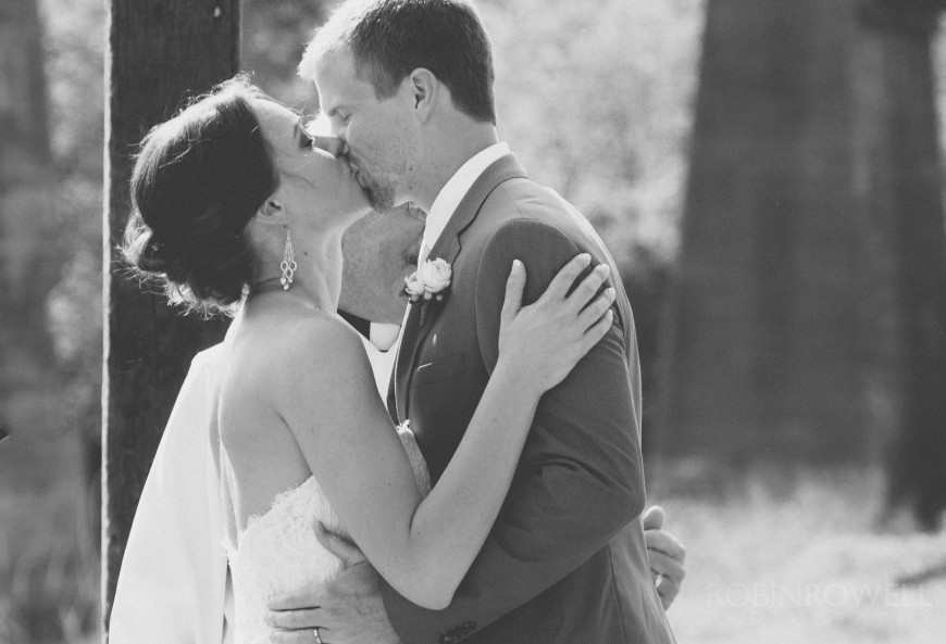 The bride and groom kiss - ranch style wedding in Leander, TX
