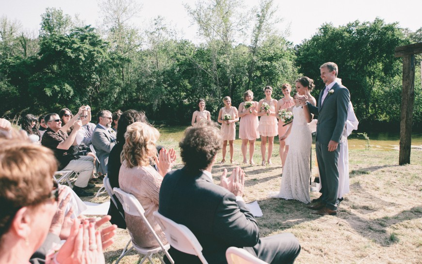 The newlyweds are presented to the guests at the ceremony - ranch style wedding in Leander, TX
