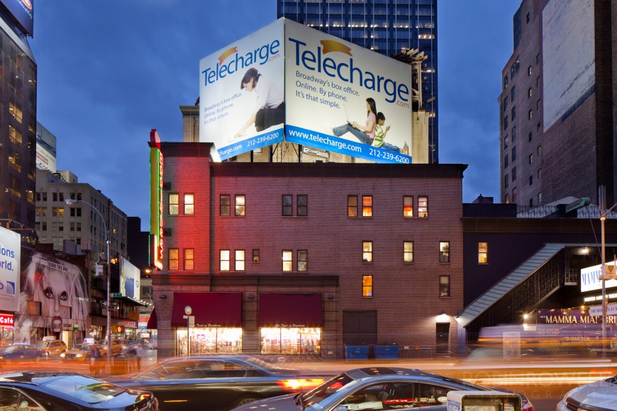 Rooftop signage for "Telecharge.com" in NYC
