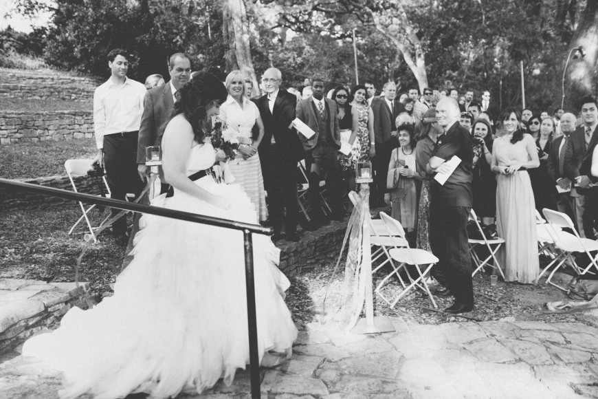 The wedding attendees look on at the bride at Laguna Gloria - Austin, TX