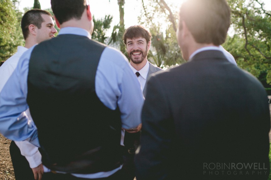 The groom shares a laugh with his friends after the ceremony at Laguna Gloria - Austin, TX