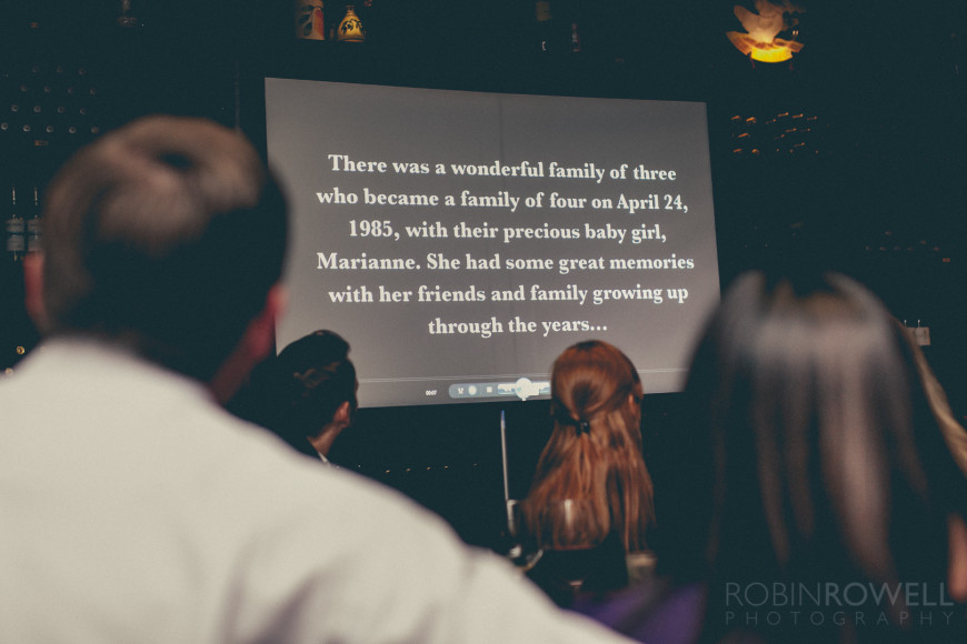 A slideshow begins to play during the rehearsal dinner at Grotto Ristorante - Woodlands, TX