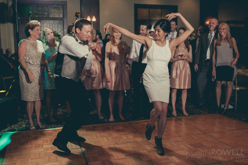 60s movie style cinematic photo of the bride and groom dancing The Woodlands Country Club - Palmer Course
