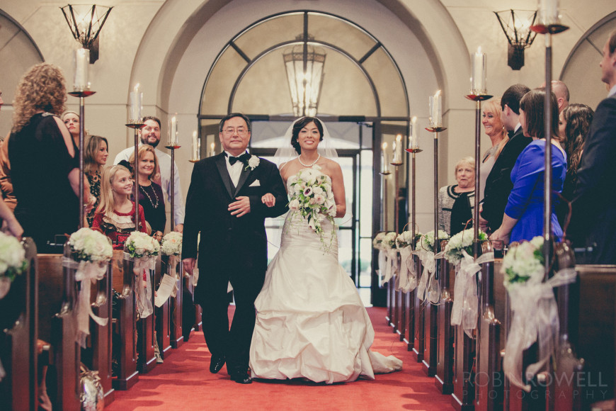 The stunning bride walks by the onlookers at The Woodlands United Methodist Church