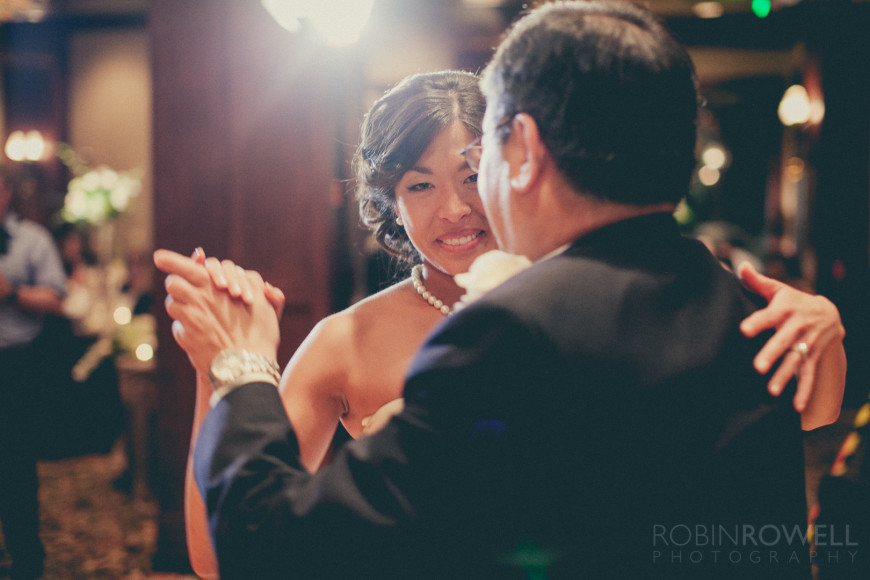 The bride with an emotional smile while dancing eith her father at The Woodlands Country Club - Palmer Course