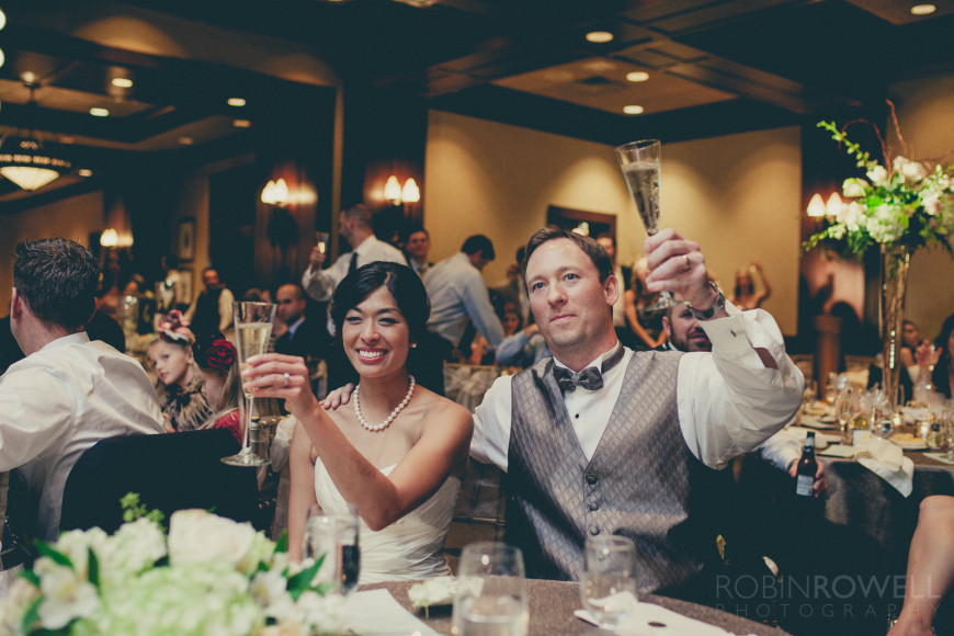 The newlyweds raise their champagne in toast at The Woodlands Country Club - Palmer Course