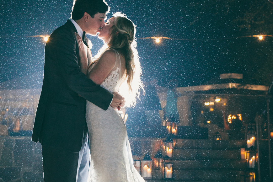 A backlit kiss in the rain